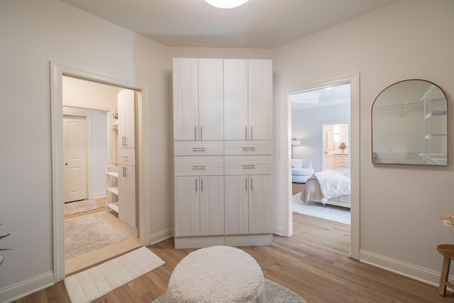 255 S 41st St Unit 171, West Des Moines, IA 50265 - hallway featuring light wood-style flooring