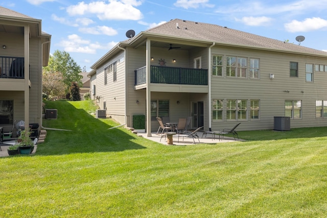 255 S 41st St Unit 171, West Des Moines, IA 50265 - rear view of house featuring a balcony, a patio, a lawn, and ceiling fan