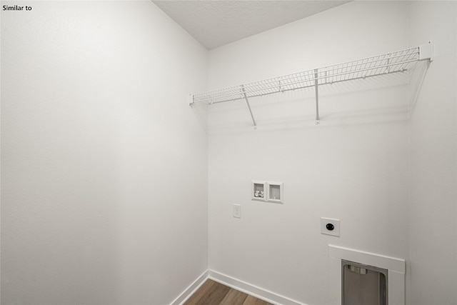 1620 NW Jackson Dr, Ankeny, IA 50023 - laundry area featuring hookup for an electric dryer, washer hookup, dark wood-style floors, and a textured ceiling