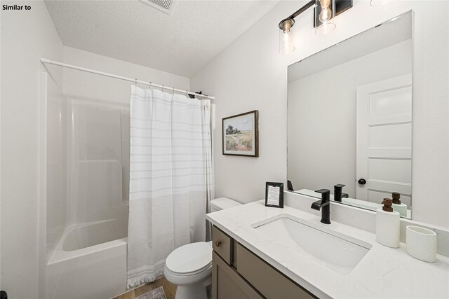 1620 NW Jackson Dr, Ankeny, IA 50023 - bathroom with vanity, shower / bath combination with curtain, and a textured ceiling
