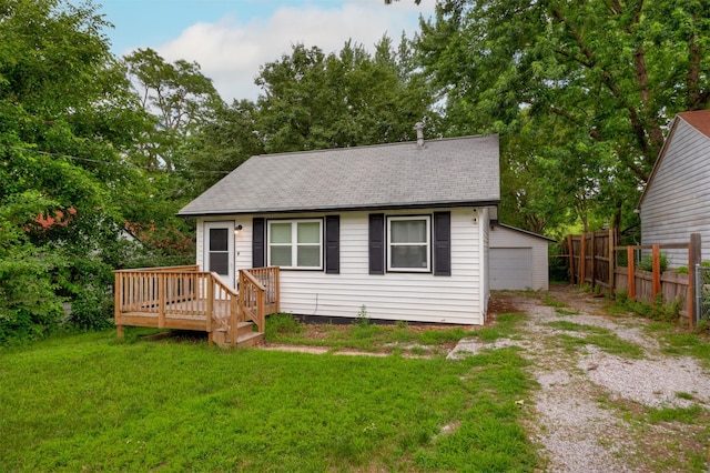 3416 Garfield Ave, Des Moines, IA 50317 - view of front of property featuring a shingled roof, a deck, dirt driveway, an outbuilding, and a garage