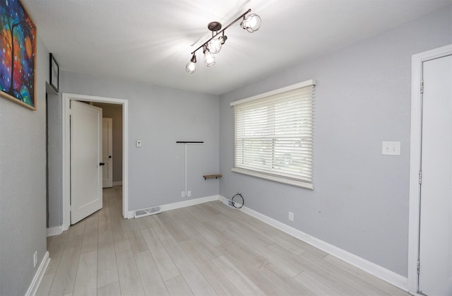 3416 Garfield Ave, Des Moines, IA 50317 - spare room with light wood finished floors and baseboards