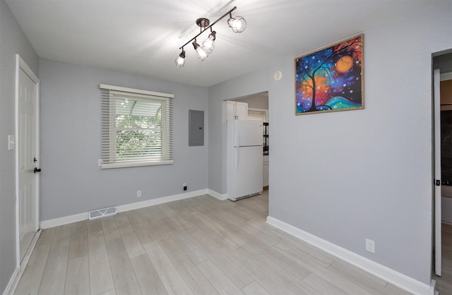 3416 Garfield Ave, Des Moines, IA 50317 - empty room featuring electric panel and light wood-style floors