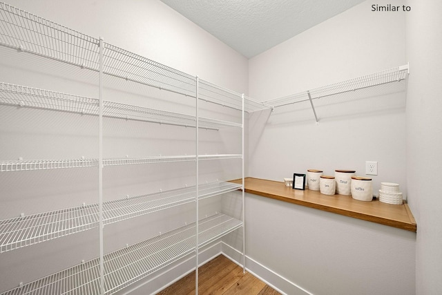 2281 Green Leaf Cir, Norwalk, IA 50211 - spacious closet featuring wood finished floors