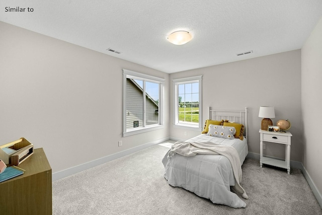 2281 Green Leaf Cir, Norwalk, IA 50211 - carpeted bedroom with baseboards and a textured ceiling