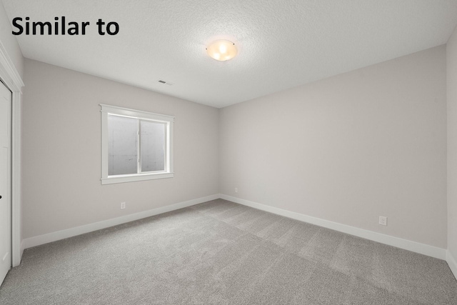 2281 Green Leaf Cir, Norwalk, IA 50211 - empty room with carpet and a textured ceiling