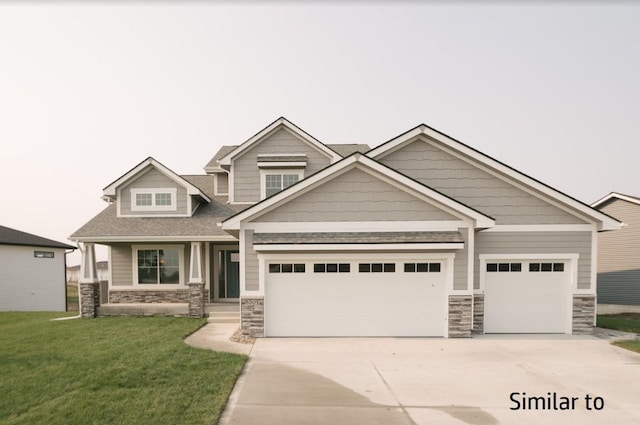 2281 Green Leaf Cir, Norwalk, IA 50211 - craftsman-style home with stone siding, driveway, and a front lawn