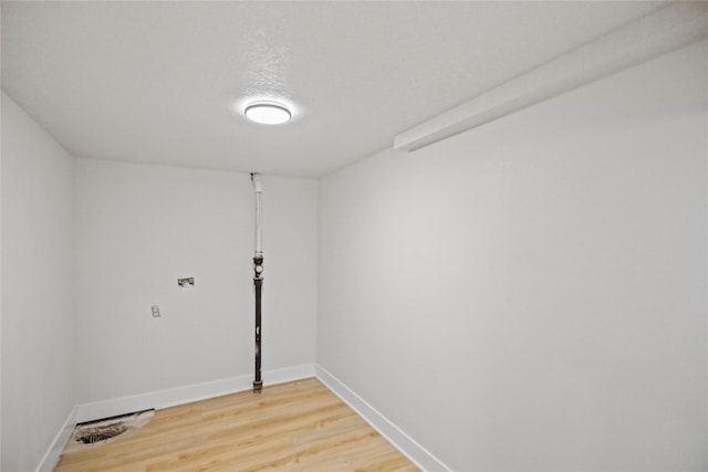 2420 E 37th St, Des Moines, IA 50317 - washroom featuring light wood-type flooring and baseboards