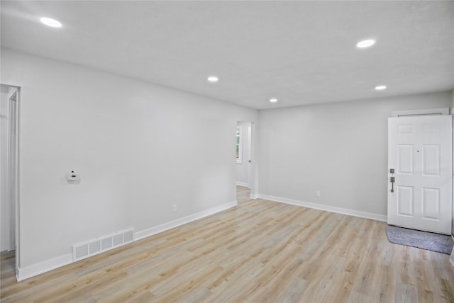 2420 E 37th St, Des Moines, IA 50317 - unfurnished room featuring light wood finished floors and recessed lighting