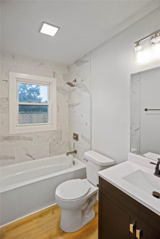 2420 E 37th St, Des Moines, IA 50317 - bathroom featuring  shower combination, vanity, and wood finished floors