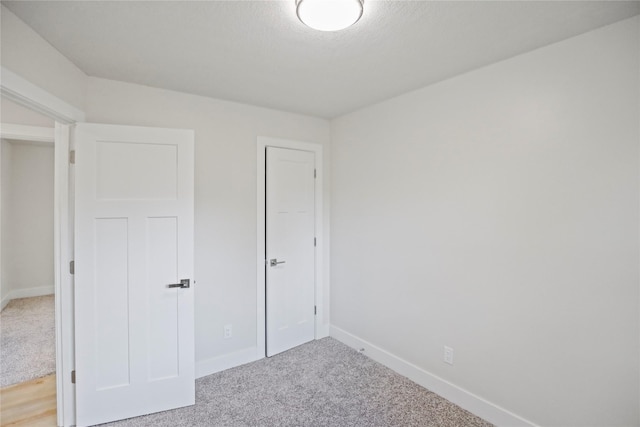 2420 E 37th St, Des Moines, IA 50317 - unfurnished bedroom featuring carpet floors