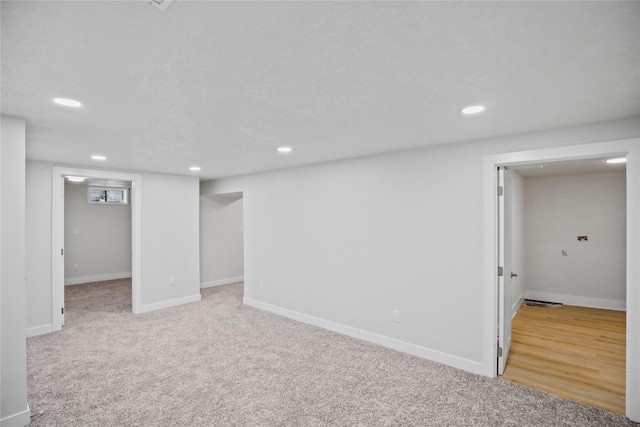 2420 E 37th St, Des Moines, IA 50317 - finished below grade area featuring recessed lighting and light colored carpet