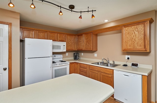 8302 Westown Pkwy Unit 3102, West Des Moines, IA 50266 - kitchen featuring white appliances, light countertops, brown cabinetry, and recessed lighting