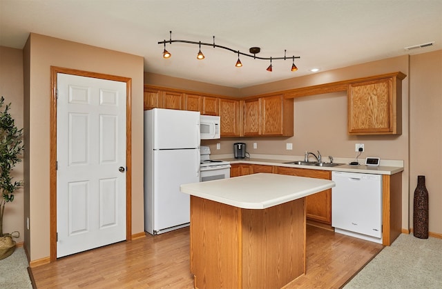 8302 Westown Pkwy Unit 3102, West Des Moines, IA 50266 - kitchen with white appliances, light countertops, light wood-type flooring, and a kitchen island