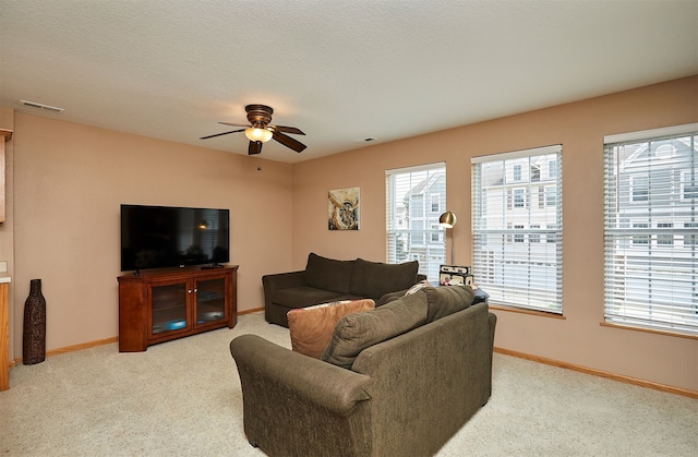 8302 Westown Pkwy Unit 3102, West Des Moines, IA 50266 - living room with a ceiling fan, healthy amount of natural light, and light colored carpet