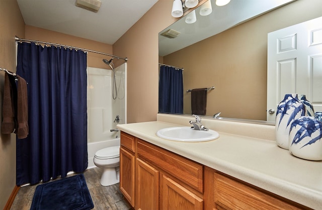 8302 Westown Pkwy Unit 3102, West Des Moines, IA 50266 - bathroom featuring vanity, shower / bath combo with shower curtain, and wood finished floors
