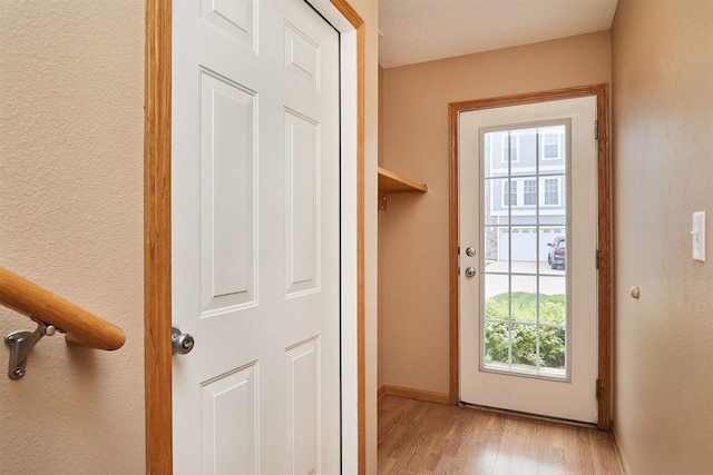 8302 Westown Pkwy Unit 3102, West Des Moines, IA 50266 - doorway featuring light wood-style flooring and baseboards