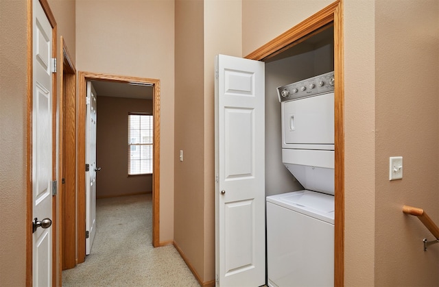 8302 Westown Pkwy Unit 3102, West Des Moines, IA 50266 - laundry room with estacked washer and dryer and baseboards