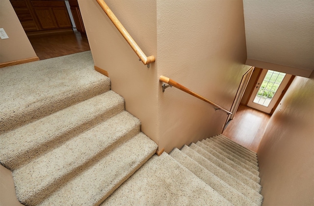 8302 Westown Pkwy Unit 3102, West Des Moines, IA 50266 - staircase featuring wood finished floors and carpet floors