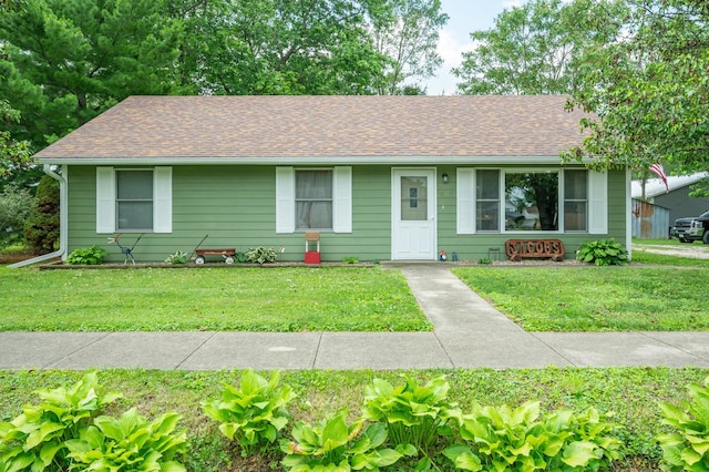 605 Grand St, New Virginia, IA 50210 - ranch-style house featuring a front yard and roof with shingles