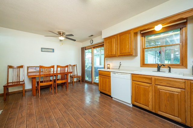 605 Grand St, New Virginia, IA 50210 - kitchen with dishwasher, light countertops, brown cabinets, and dark wood-style floors