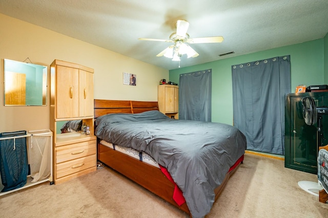 605 Grand St, New Virginia, IA 50210 - bedroom with light carpet and ceiling fan