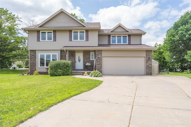 130 SW Meadowlark Ct, Ankeny, IA 50023 - view of front facade with an attached garage, driveway, and brick siding