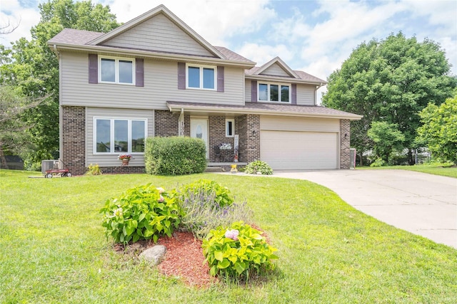 130 SW Meadowlark Ct, Ankeny, IA 50023 - view of front of house featuring driveway, brick siding, a front lawn, and a garage