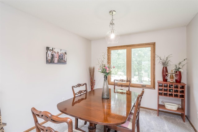 130 SW Meadowlark Ct, Ankeny, IA 50023 - dining room featuring baseboards and light carpet
