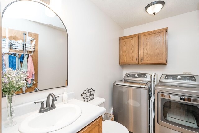130 SW Meadowlark Ct, Ankeny, IA 50023 - half bathroom with washer and clothes dryer and vanity
