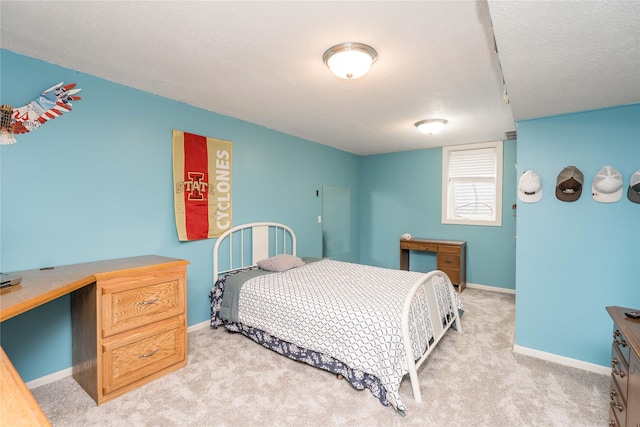 130 SW Meadowlark Ct, Ankeny, IA 50023 - bedroom featuring light colored carpet, a desk, and a textured ceiling