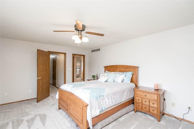 130 SW Meadowlark Ct, Ankeny, IA 50023 - carpeted bedroom with baseboards and a ceiling fan