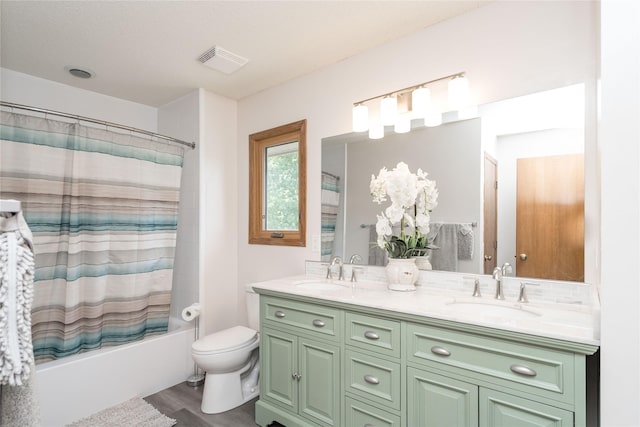 130 SW Meadowlark Ct, Ankeny, IA 50023 - bathroom with double vanity, shower / tub combo with curtain, and wood finished floors