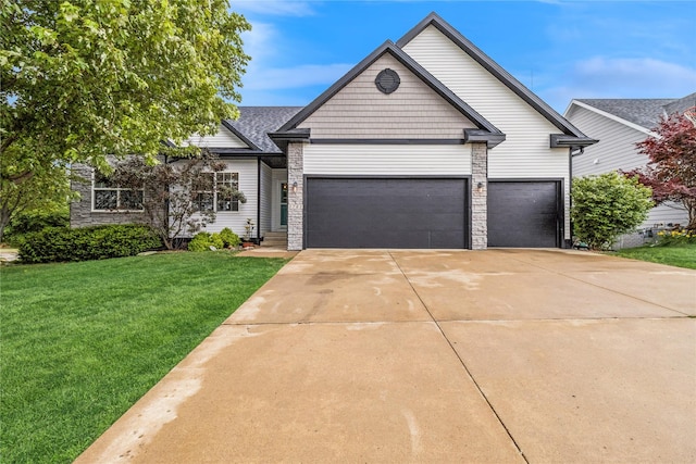 1701 2nd Ave SW, Altoona, IA 50009 - view of front of home featuring concrete driveway, a garage, and a front yard