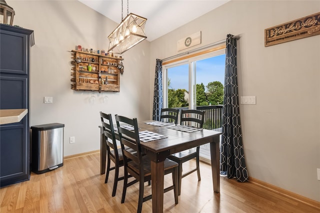 1701 2nd Ave SW, Altoona, IA 50009 - dining space featuring light wood finished floors and a chandelier