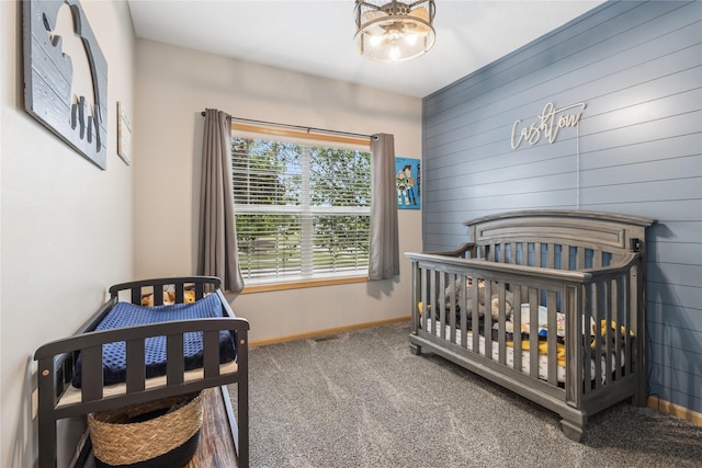1701 2nd Ave SW, Altoona, IA 50009 - carpeted bedroom featuring baseboards and wood walls