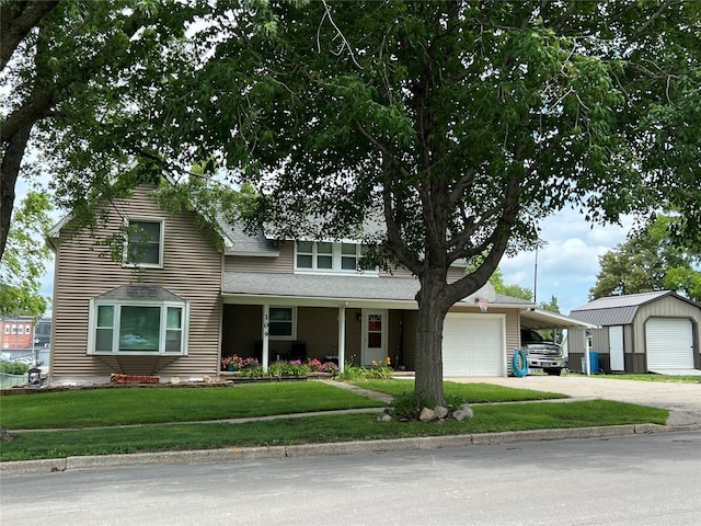 109 E Jackson St, Panora, IA 50216 - traditional home featuring driveway, a garage, a front yard, and a shingled roof