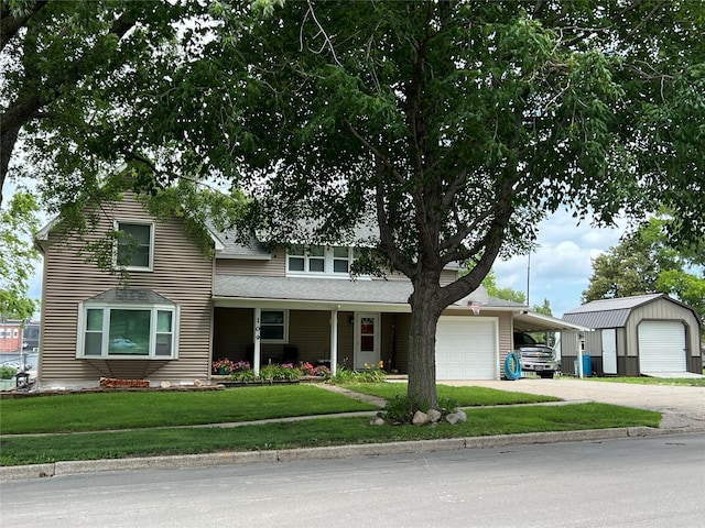 109 E Jackson St, Panora, IA 50216 - view of front of home featuring concrete driveway, a front yard, and roof with shingles