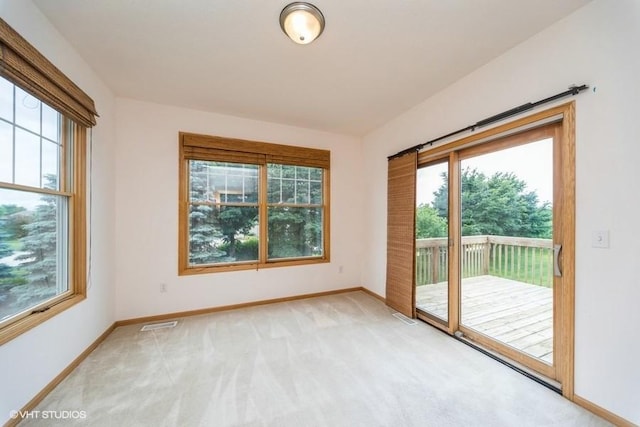 8318 Boulder Dr, West Des Moines, IA 50266 - unfurnished room with plenty of natural light and light colored carpet