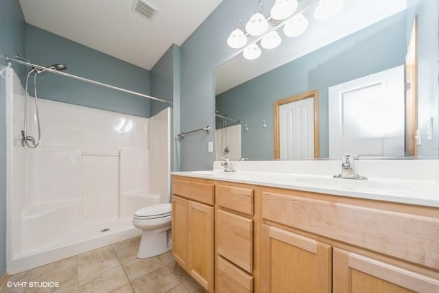 8318 Boulder Dr, West Des Moines, IA 50266 - bathroom with a shower, double vanity, and tile patterned flooring