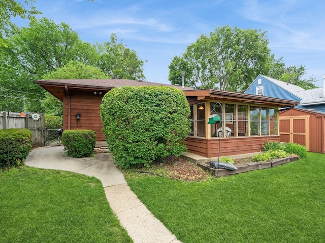 2400 Farwell Rd, Des Moines, IA 50317 - back of property with a storage unit and a sunroom