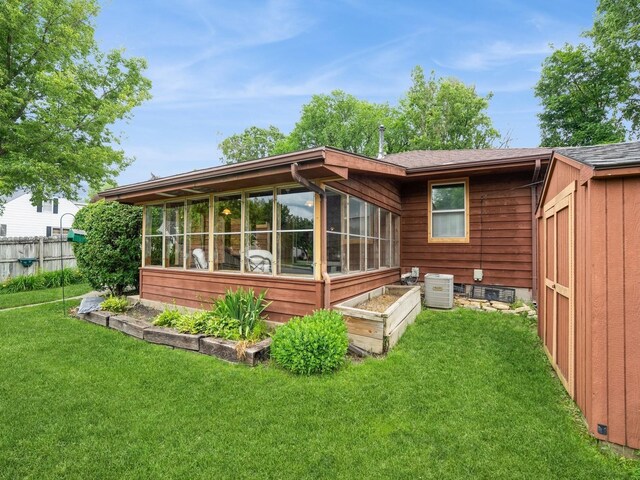 2400 Farwell Rd, Des Moines, IA 50317 - back of house featuring a sunroom