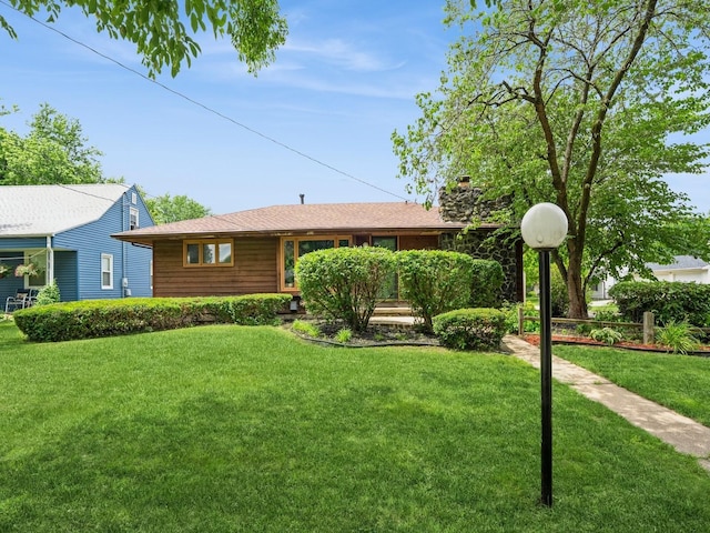 2400 Farwell Rd, Des Moines, IA 50317 - ranch-style home with a front yard and a chimney