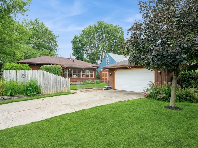 2400 Farwell Rd, Des Moines, IA 50317 - view of front of property featuring driveway, an attached garage, and an outbuilding