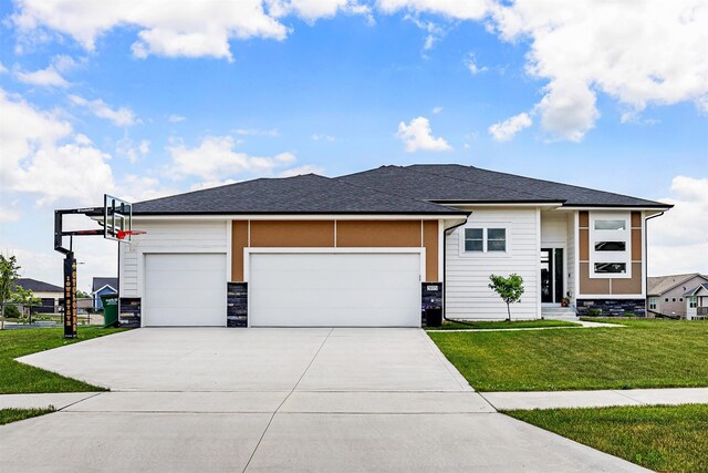 309 NW Beechwood Dr, Grimes, IA 50111 - view of front of property with stone siding, a front lawn, a garage, driveway, and a shingled roof