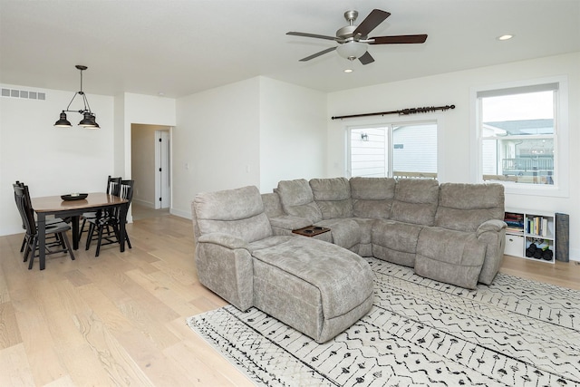 309 NW Beechwood Dr, Grimes, IA 50111 - living room with light wood-type flooring, ceiling fan, and recessed lighting