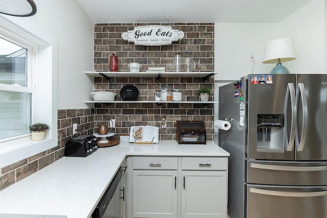 309 NW Beechwood Dr, Grimes, IA 50111 - kitchen with appliances with stainless steel finishes, open shelves, tasteful backsplash, and light countertops