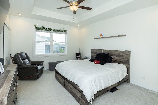 309 NW Beechwood Dr, Grimes, IA 50111 - bedroom with light colored carpet, recessed lighting, a raised ceiling, and ceiling fan