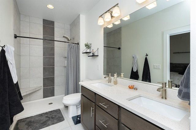309 NW Beechwood Dr, Grimes, IA 50111 - full bath featuring double vanity, tile patterned flooring, tiled shower, and recessed lighting