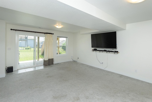 309 NW Beechwood Dr, Grimes, IA 50111 - unfurnished living room with carpet floors and healthy amount of natural light
